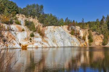 Black artificial lake and hills - mining and production of copper in Bor, Serbia