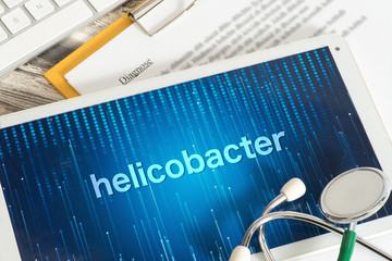 Stethoskop und Tablet PCmit Diagnose Helicobacter
