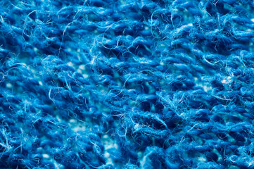 Macro of blue denim fabric texture background textile knitted woven weaving weave