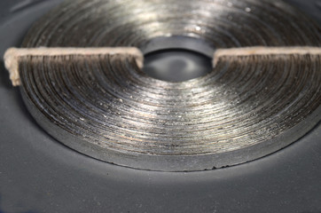 Closeup on a roll of Magnesium band. (Mg)