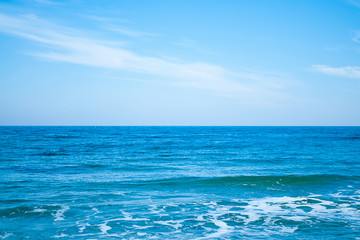 Horizon between blue sea and blue sky
