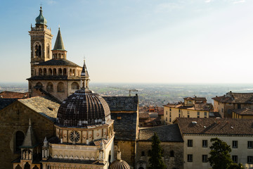 Obraz premium Bergamo Upper city, Italy. March 2019. The stunning Basilica of Santa Maria Maggiore, a romanic and gothic church landmark of this town seen from the town hall bell tower