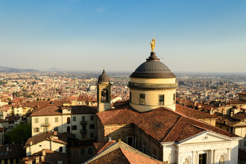 Fototapeta na wymiar Panoramic aerial view of Bergamo Alta, the upper city. It is a medieval town in northern Italy, in the background the lowercity in the lowland