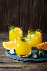 Fresh summer cocktail with orange and mint