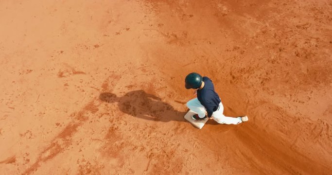 OVERHEAD CRANE Base runner attempts to touch a base during a baseball game. 4K UHD 60 FPS SLO MO RAW