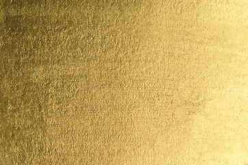 Gold background. Gold metallic texture. Trendy template for holi