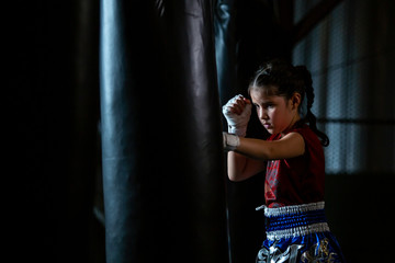 Little girl Thai boxing training is a self defense course, Muay Thai.