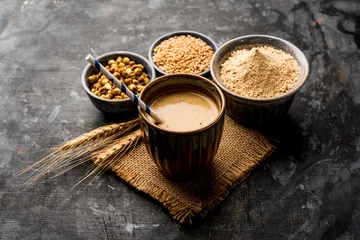 Fotobehang Koffiebar Sattu sharbat is a cooling sweet drink made in summer with roasted black chickpea flour, barley, suger, salt & water. served in a glass. selective focus
