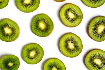 Sliced kiwi fruit on white background pattern