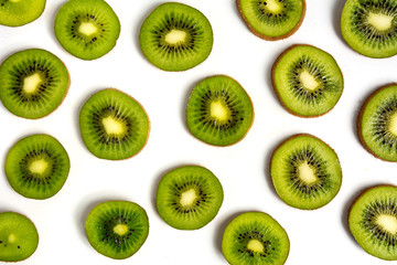 Sliced kiwi fruit on white background pattern