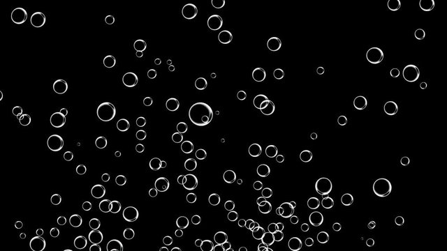 Water bubbles rising up on the black background