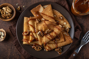 crepes with salted caramel and nuts - obrazy, fototapety, plakaty