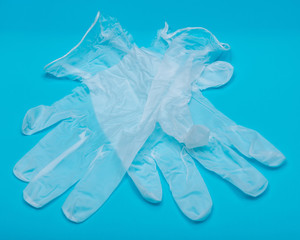 Medical Exam Quality Vinyl Gloves on colorful background.