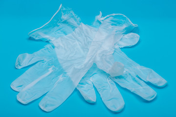 Medical Exam Quality Vinyl Gloves on colorful background.