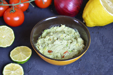 Mexican Guacamole in MolcajeteGuacamole prepared in a traditional volcanic stone bowl called molcajete