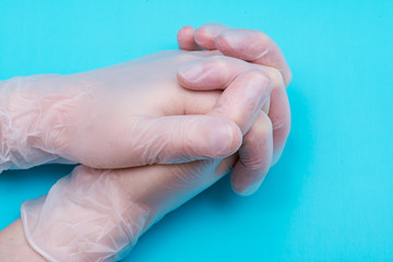 Medical Exam Quality Vinyl Gloves on colorful background.