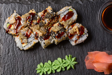 Smoked salmon roll sushi served on blackstone