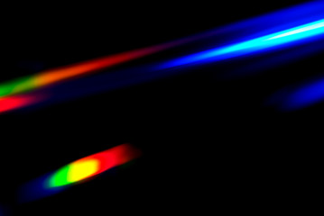 Abstract colorful spectrum in darkness. Colorful rays of light.