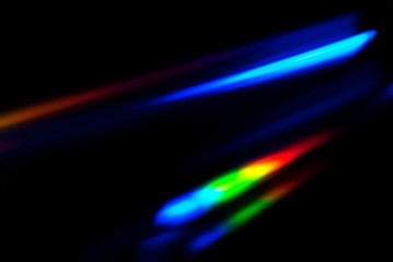 Abstract colorful spectrum in darkness. Colorful rays of light. - obrazy, fototapety, plakaty