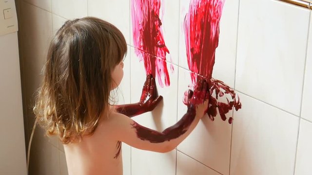 Adorable Small Girl is Painting on the Wall. Full HD Slow Motion