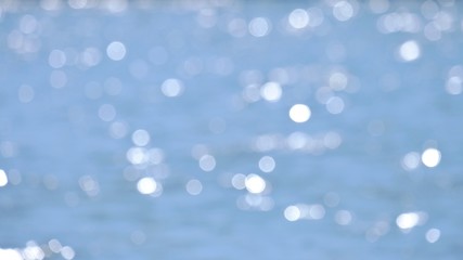  Blurred water surface with bokeh light and blue color for background texture 