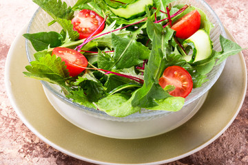 Bowl of salad with greens