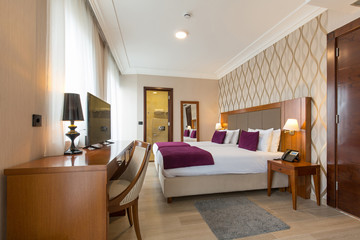 Luxury double bed hotel bedroom interior