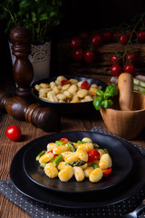 crispy gnocchi with roasted asparagus and tomatoes