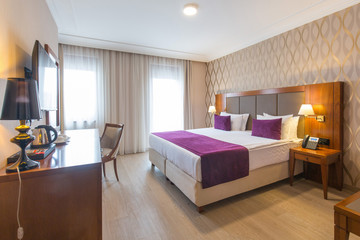 Luxury double bed hotel bedroom interior