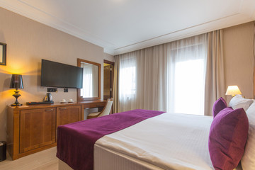 Luxury double bed hotel bedroom interior