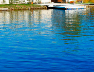 Fototapeta na wymiar River bank with dramatic reflections background hd