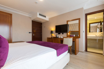 Luxury double bed hotel bedroom interior