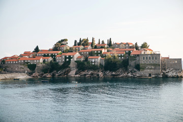 Fototapeta na wymiar Beautiful view of the island of Sveti Stefan or Sveti Stefan in Montenegro. One of the famous sights of Montenegro.