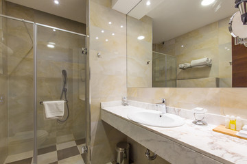Hotel bathroom interior with shower cabin