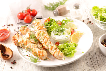 Fototapeta na wymiar grilled chicken with salad and sauce