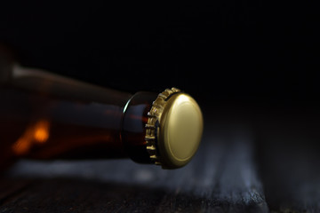 Close-up of beer glass bottle neck with lid