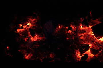Fototapeta na wymiar Hot coals in the night