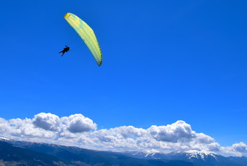 Paraglider and mountains