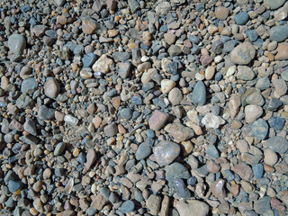 Color pebble stone in background in sunny day