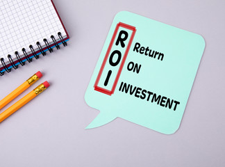 Return on Investment, ROI concept. Paper speech bubbleh