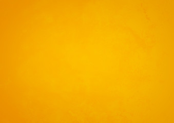 Bright grunge background of yellows and orange color. Imitation of the texture of the old wall.
