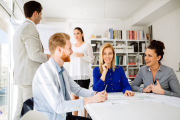 Fototapeta premium Group of business people working as team in office
