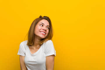 Fototapeta premium Young natural caucasian woman dreaming of achieving goals and purposes