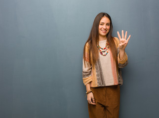 Young hippie woman showing number four