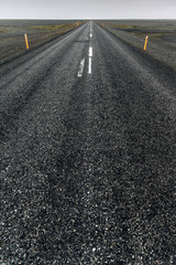 Empty long road in foggy weather.