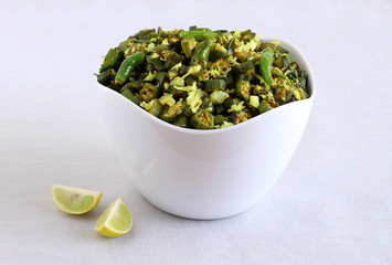 Bhindi curry, an Indian, delicious, and vegetarian cuisine made from okra, is a side dish for items like chapati and roti, in a bowl.