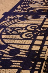 fence shadow silhouette on the ground in the street, shadow background