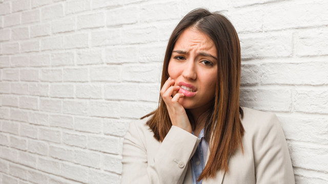 Young Business Woman Biting Nails, Nervous And Very Anxious