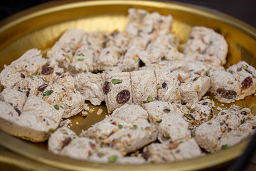 Eastern sweets with nuts and raisins on a platter