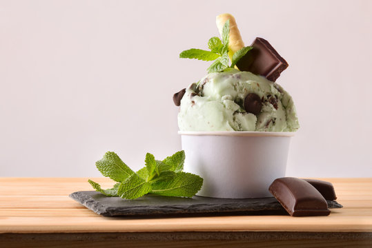 Mint and choco ice cream cup decorated with leaves